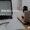 Solidworks Learn The Basics - Laptop and Notepad on Desk