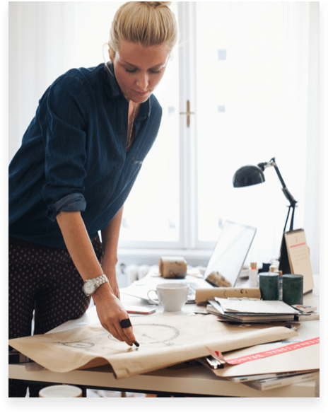 designer looking at a drawing