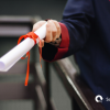Person holding diploma certificate